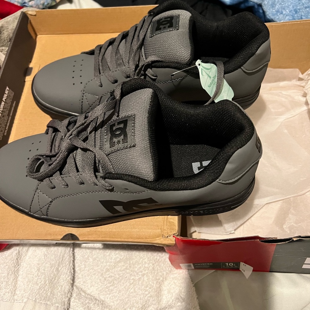 DC silver leather skate shoes. New with tags.